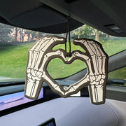 Two skeleton hands forming a heart shape in bold black and white Hilton Hanging Car Air Freshener