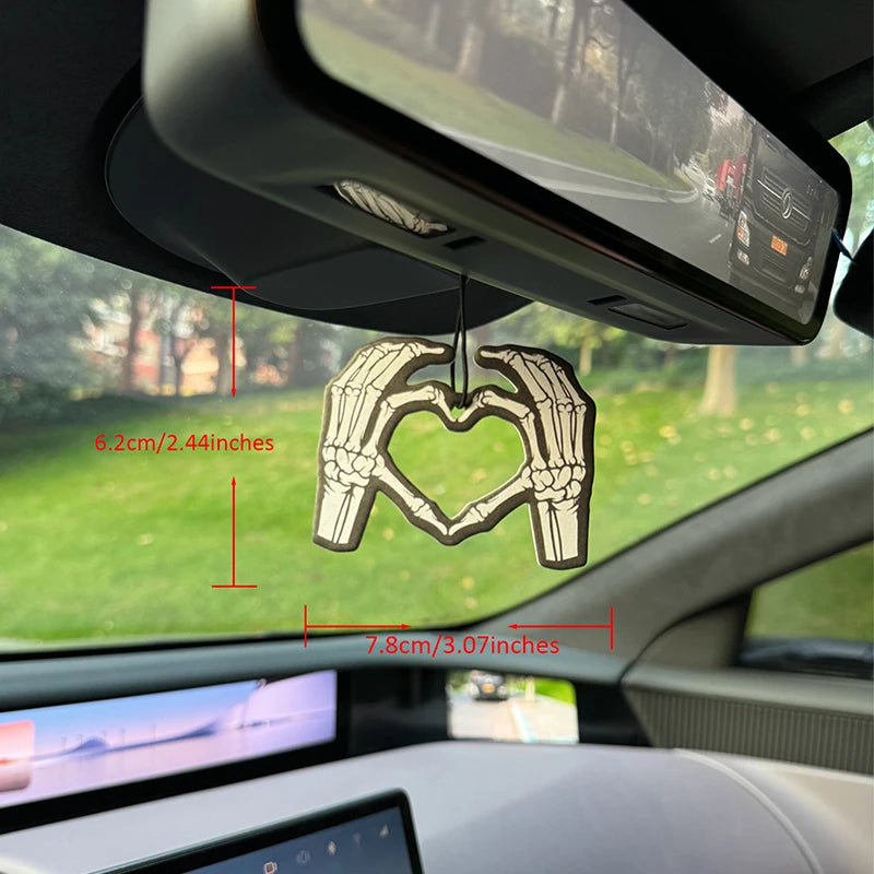 Two skeleton hands forming a heart shape in bold black and white Hilton Hanging Car Air Freshener